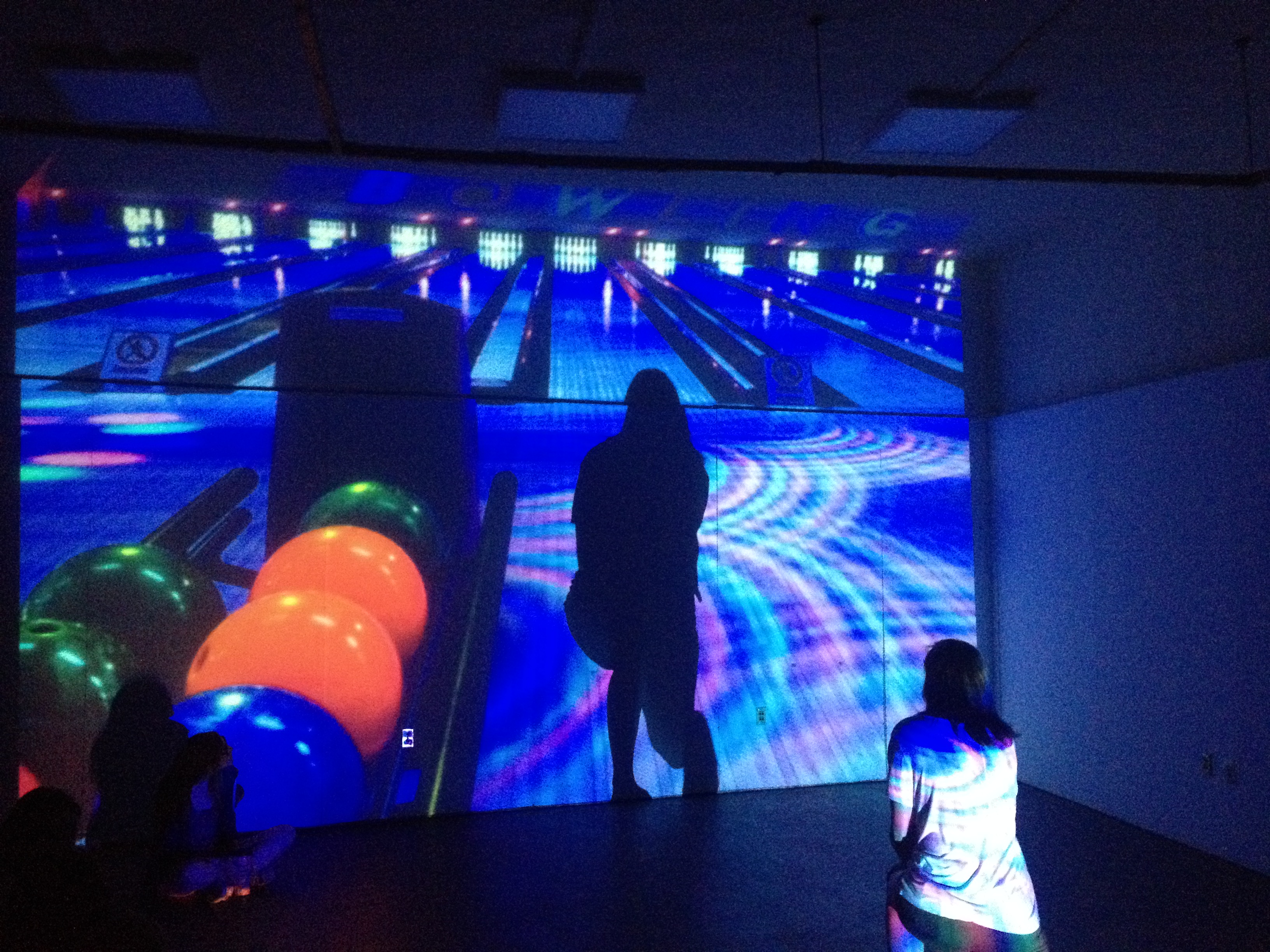 a bowling photo with a shadow person