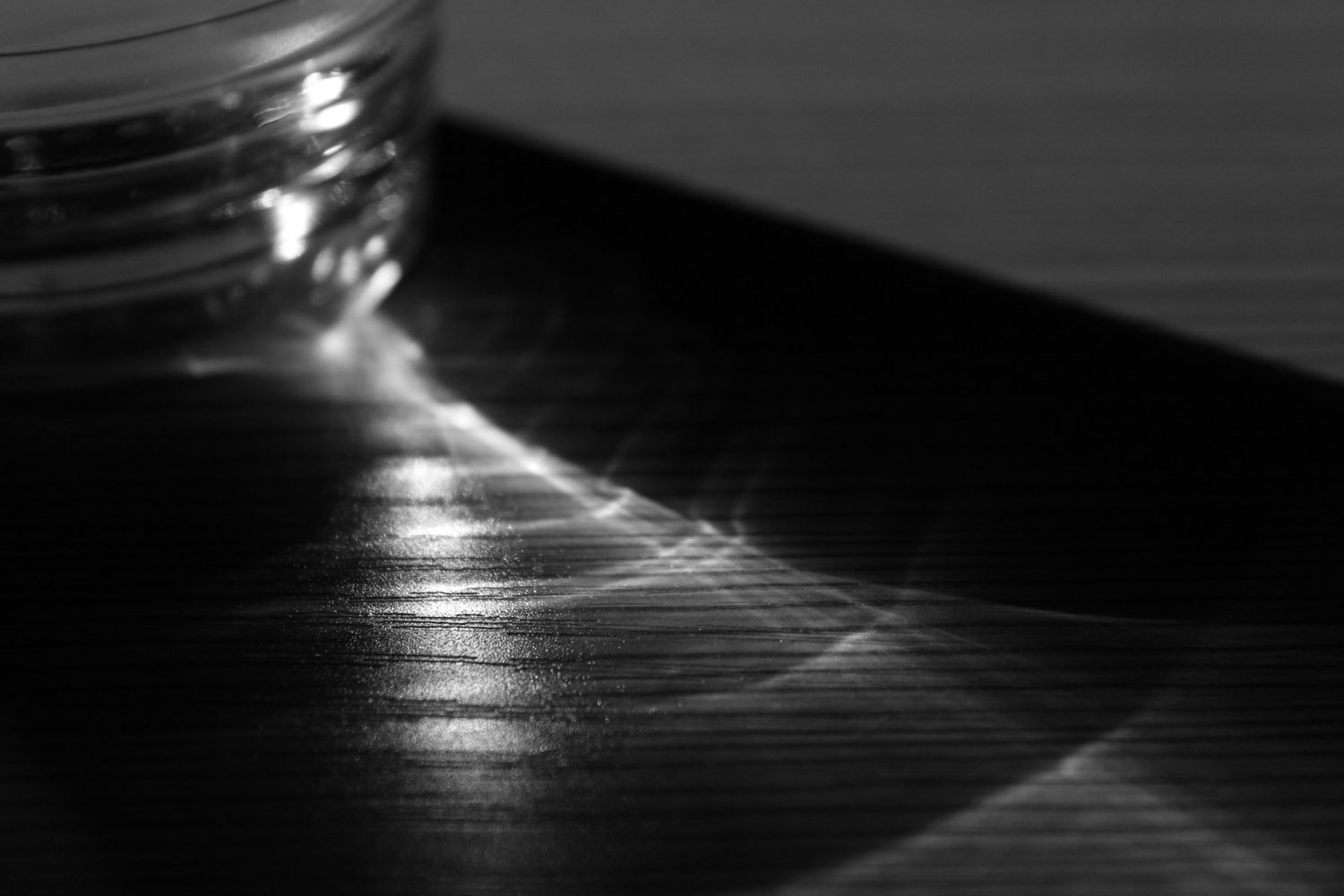 Photo of light reflected through a cup of water by Chloe Atchue-Mamlet